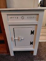 Full view of antique white cooler box front