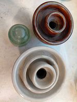 Top view showing three insulators: brown porcelain, white porcelain, aqua glass