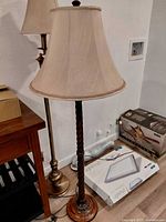 Full view of dark wood spiral floor lamp with shade
