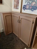 Front view of L-shaped cabinet showing doors and finish