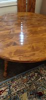 Top view of round wooden table with center seam