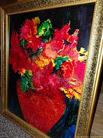 Front angled view of the framed painting showing vivid colors and gold frame detail