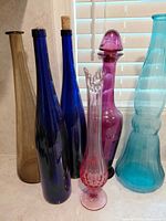 All six glass pieces lined on countertop