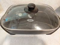 Skillet with lid showing brand logo
