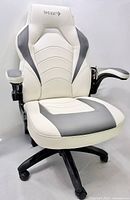 Front angled view showing overall chair design, upholstery and base