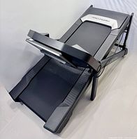 Folded ProForm Carbon TL treadmill showing frame and deck