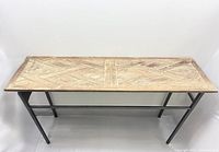 Front view of console table showing wood top and metal frame