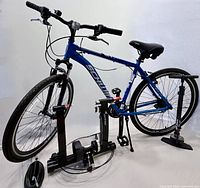 Full view of Schwinn GTX-3 bike on trainer stand with accessories