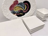 Complete set displayed: platter, stacks of dinner plates, salad plates, and bowls