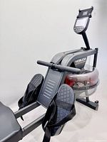 Side view showing handlebar, console, footplates, tank