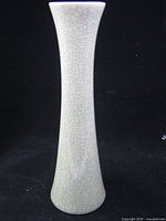 Full view of vase front showing tall slender shape and crackle glaze