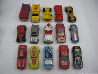 All fifteen die-cast cars laid out in three rows