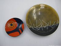 Both enamel plates side by side