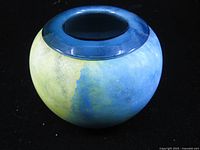 Top view of handblown glass vase showing dark teal rim opening