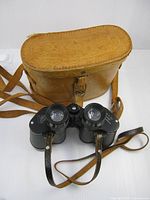 Binoculars front with leather case