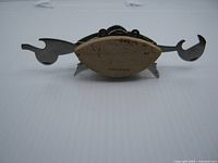 Front view of crab multi tool with two implement claws extended