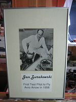 Full view of framed photograph showing frame, mat, image and caption