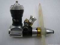 Left side view showing cylinder head, crankcase, propeller hub