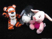 Front view of all three plush toys Piglet, Tigger, Eeyore