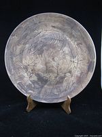 Front view of charger on stand showing full leaf pattern