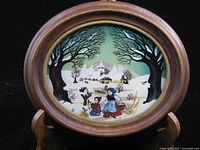 Frontal view of reverse glass painting in oval wood frame