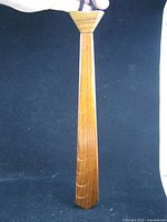 Front view of teak wood tie showing tapered shape