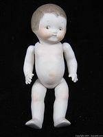 Front view of bisque doll showing condition, joints and facial features