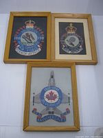 Group shot of all three framed RCAF needlepoint pictures