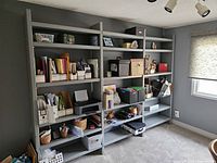 front view of full shelving unit with contents