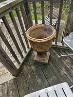 Full view of concrete urn on deck