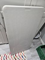 Table folded, front view showing Lifetime logo on top edge