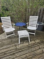 Full view of both chairs, ottoman, and flower table on deck