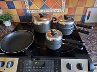 Entire cookware set displayed on stovetop