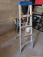 Front view of aluminum step ladder showing height and steps