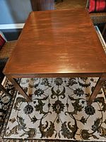 Top view of teak dining table showing finish and size