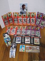 Full lot overview with sealed pin/card packs, loose card stacks and boxed pack