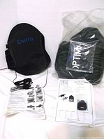 Delta back brace, Optima brace in sealed bag, and instruction sheets