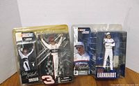 Three sealed Dale Earnhardt McFarlane NASCAR figures in original packaging