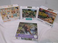 Group shot of four dog-themed puzzle boxes