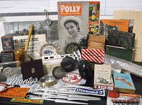 Overall view of assorted vintage items laid out on table