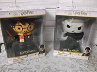 Front view of both boxed bobble heads