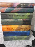 Front spines of all seven Harry Potter hardcovers with dust jackets