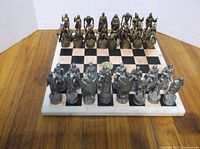 Full view of marble board with all 32 Star Wars metal pieces arranged for play