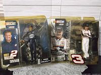 Both sealed McFarlane NASCAR figures side by side in packaging
