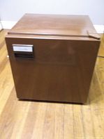 Front view of brown Avanti mini refrigerator