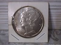 Obverse of round showing Mercury Head Liberty design in flip