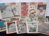 All fourteen magazine issues laid out showing front covers