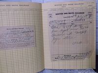 Open scrapbook showing Boston and Maine Railroad Form 19 order pasted on ruled page