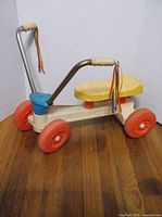 Left side view of Playskool ride-on showing full profile