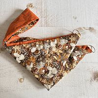 Pie carrier folded showing mushroom print and handle